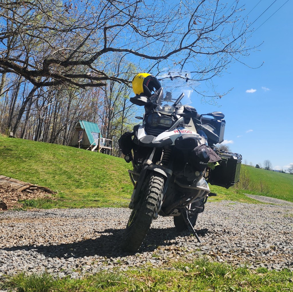 Overlanding motorcycle parked at Breath of Dawn VA Cabin Southwest Virginia Farmstay. 